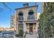 Beautiful brick two-story home featuring balconies, columns, and an elegant front door with lion statues at 1650 N Pennsylvania St, Denver, CO 80203