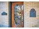 Ornate wood door with intricate carvings and a landmark plaque at 1650 N Pennsylvania St, Denver, CO 80203