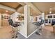 Finished basement featuring a wet bar with barstool seating and neutral decor at 2116 Ridgetrail Dr, Castle Rock, CO 80104