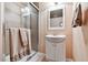 Bathroom with a glass-enclosed shower, white vanity, and neutral-colored towels for a clean aesthetic at 2116 Ridgetrail Dr, Castle Rock, CO 80104