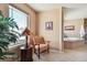 Serene bathroom sitting area with natural light and view at 2116 Ridgetrail Dr, Castle Rock, CO 80104