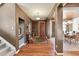 Inviting entryway with hardwood floors and a view into the dining room at 2116 Ridgetrail Dr, Castle Rock, CO 80104