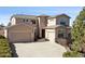 Beautiful two-story home with a three-car garage and stone accents at 2116 Ridgetrail Dr, Castle Rock, CO 80104