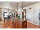 Kitchen island with granite countertops and bar seating at 2116 Ridgetrail Dr, Castle Rock, CO 80104