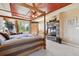 Cozy main bedroom showcases a large window and stone fireplace for relaxation at 2116 Ridgetrail Dr, Castle Rock, CO 80104