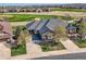 Aerial view of the home featuring a well-manicured lawn and backing onto a golf course at 8233 E 149Th Dr, Thornton, CO 80602
