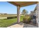 Relaxing backyard patio with view of lush green lawn and golf course at 8233 E 149Th Dr, Thornton, CO 80602