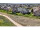Spacious backyard with stone patio and lush green landscaping, located on a golf course at 8233 E 149Th Dr, Thornton, CO 80602