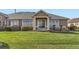 Charming single-story home with well-manicured lawn, mature landscaping, and inviting entrance at 8233 E 149Th Dr, Thornton, CO 80602
