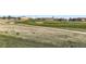 Scenic golf course with a sand bunker, with single Gathering homes in background at 8233 E 149Th Dr, Thornton, CO 80602
