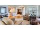 Inviting living room showcasing stylish furniture, hardwood floors, and a view of the home's entryway at 8233 E 149Th Dr, Thornton, CO 80602