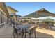 Relaxing outdoor patio seating area with tables, chairs and shaded umbrellas at 8233 E 149Th Dr, Thornton, CO 80602