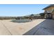Pool area with fence, lounging chairs, umbrellas, and beautiful landscaping at 8233 E 149Th Dr, Thornton, CO 80602