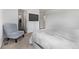 Bedroom features carpet, chair, television and doorway to closet and on-suite at 350 Mesa Ave, Lochbuie, CO 80603
