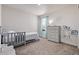 This well-lit ' bedroom is enhanced by a neutral decor and a soft carpet at 350 Mesa Ave, Lochbuie, CO 80603