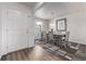 Light filled dining area features a dining table with seating for six and a large window at 350 Mesa Ave, Lochbuie, CO 80603
