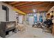 Unfinished basement with a vintage wood-burning stove, ready for customization at 356 Castlewood Dr, Evergreen, CO 80439