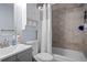 Bathroom featuring a shower and tub combination and vanity with cabinet storage at 356 Castlewood Dr, Evergreen, CO 80439