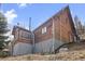 Charming wood-sided home with a walkout basement and a serene, wooded backdrop at 356 Castlewood Dr, Evergreen, CO 80439