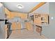 Kitchen with wooden breakfast bar, wood cabinets, stainless steel appliances and white subway tile backsplash at 356 Castlewood Dr, Evergreen, CO 80439