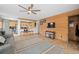 Relaxing living room featuring a wood-accent wall and seamlessly connected to the kitchen, creating an inviting atmosphere at 356 Castlewood Dr, Evergreen, CO 80439