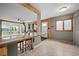 Open concept living and kitchen area, with breakfast bar seating and beautiful mountain views at 356 Castlewood Dr, Evergreen, CO 80439