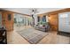Comfortable living room with a wood-burning stove and plenty of natural light, creating a warm and welcoming space at 356 Castlewood Dr, Evergreen, CO 80439