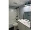 Bathroom featuring a shower-tub combo with a modern vanity and black fixtures at 2225 Buchtel Blvd # 207, Denver, CO 80210