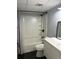 Bathroom featuring a shower-tub combo with a modern vanity at 2225 Buchtel Blvd # 207, Denver, CO 80210