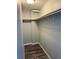 A closet space with wood-look floors and a closet rod at 2225 Buchtel Blvd # 207, Denver, CO 80210