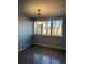 Dining room with hardwood floors and large window at 2225 Buchtel Blvd # 207, Denver, CO 80210