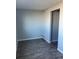 A bright room with wood-look flooring and gray walls at 2225 Buchtel Blvd # 207, Denver, CO 80210