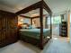 Spacious main bedroom features a canopy bed and ample natural light from the windows at 8908 Jellison Ct, Westminster, CO 80021