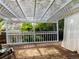 A charming covered deck provides a cozy outdoor living space with views of the surrounding lush greenery at 8908 Jellison Ct, Westminster, CO 80021