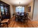Elegant dining room with wood floors, traditional furniture, and a decorative chandelier at 8908 Jellison Ct, Westminster, CO 80021