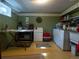 The laundry room features a washer, dryer, storage, and a utility sink, combining functionality and convenience at 8908 Jellison Ct, Westminster, CO 80021