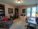 Functional home office featuring a work space, ample storage, and a cozy armchair for reading at 8908 Jellison Ct, Westminster, CO 80021