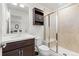 Bathroom with a dark vanity, and a tiled shower at 10859 E 25Th Dr, Aurora, CO 80010