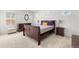 Bedroom with carpeted floors and multiple windows with white shutters at 10859 E 25Th Dr, Aurora, CO 80010