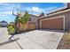 Spacious driveway and attached garage, perfect for parking and outdoor activities, including a basketball hoop at 10859 E 25Th Dr, Aurora, CO 80010