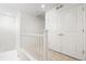 Upstairs hallway featuring carpeting and closet doors at 10859 E 25Th Dr, Aurora, CO 80010