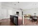 Stylish kitchen island with granite countertops and stainless steel appliances in open floorplan at 10859 E 25Th Dr, Aurora, CO 80010