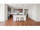 Spacious kitchen featuring an island with bar seating, granite counters, and stainless steel appliances at 10859 E 25Th Dr, Aurora, CO 80010