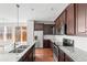Spacious kitchen featuring stainless steel appliances, granite countertops, and ample cabinet space at 10859 E 25Th Dr, Aurora, CO 80010