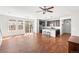 Open concept living area featuring hardwood floors, an island kitchen and bright windows at 10859 E 25Th Dr, Aurora, CO 80010