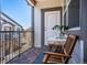 Cozy balcony features stylish wood tile floor, table with chairs, and great natural light at 4630 Copeland Cir # 201, Highlands Ranch, CO 80126