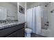 Updated bathroom with granite vanity, shower-tub combo, and sleek finishes at 4630 Copeland Cir # 201, Highlands Ranch, CO 80126