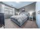 Comfortable bedroom features soft gray walls, plush carpet, and modern decor at 4630 Copeland Cir # 201, Highlands Ranch, CO 80126