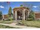 Attractive clubhouse exterior featuring stone columns and well-manicured landscaping at 4630 Copeland Cir # 201, Highlands Ranch, CO 80126