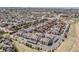 High-angle view showcasing a densely populated suburban neighborhood with apartment complexes and neatly arranged streets at 4630 Copeland Cir # 201, Highlands Ranch, CO 80126